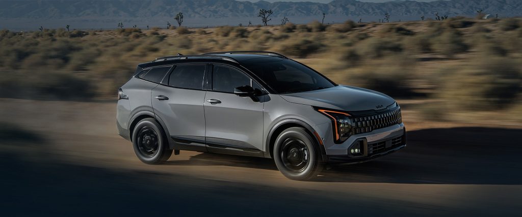 A practical 2026 Kia Sportage going down the highway near Batesville, AR 