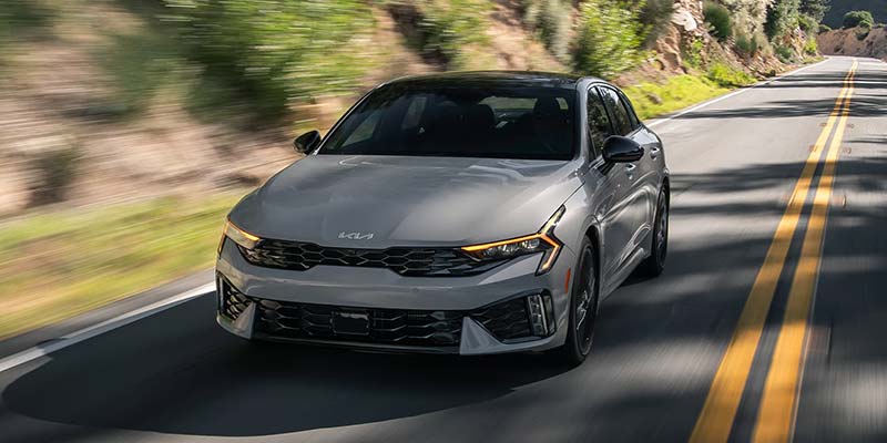 A 2026 Kia K5 speeding down the highway in Batesville, AR 