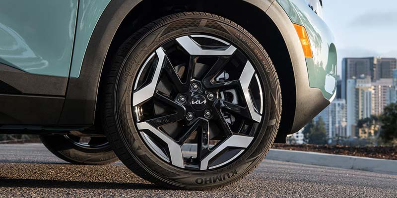The rims on a 2026 Kia Seltos which the backdrop of the big city near Batesville, AR