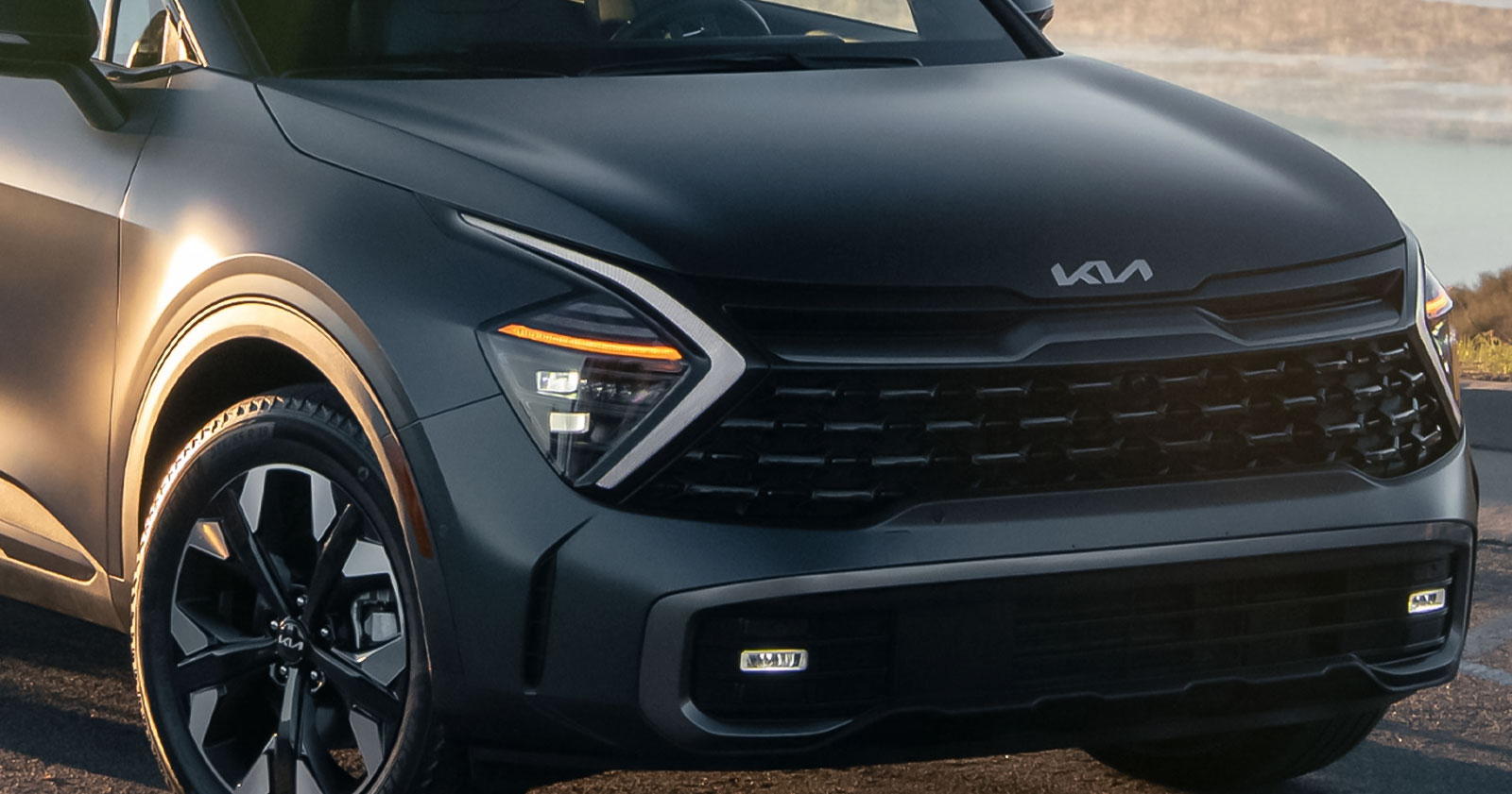 Matte black Kia SUV front close-up view
