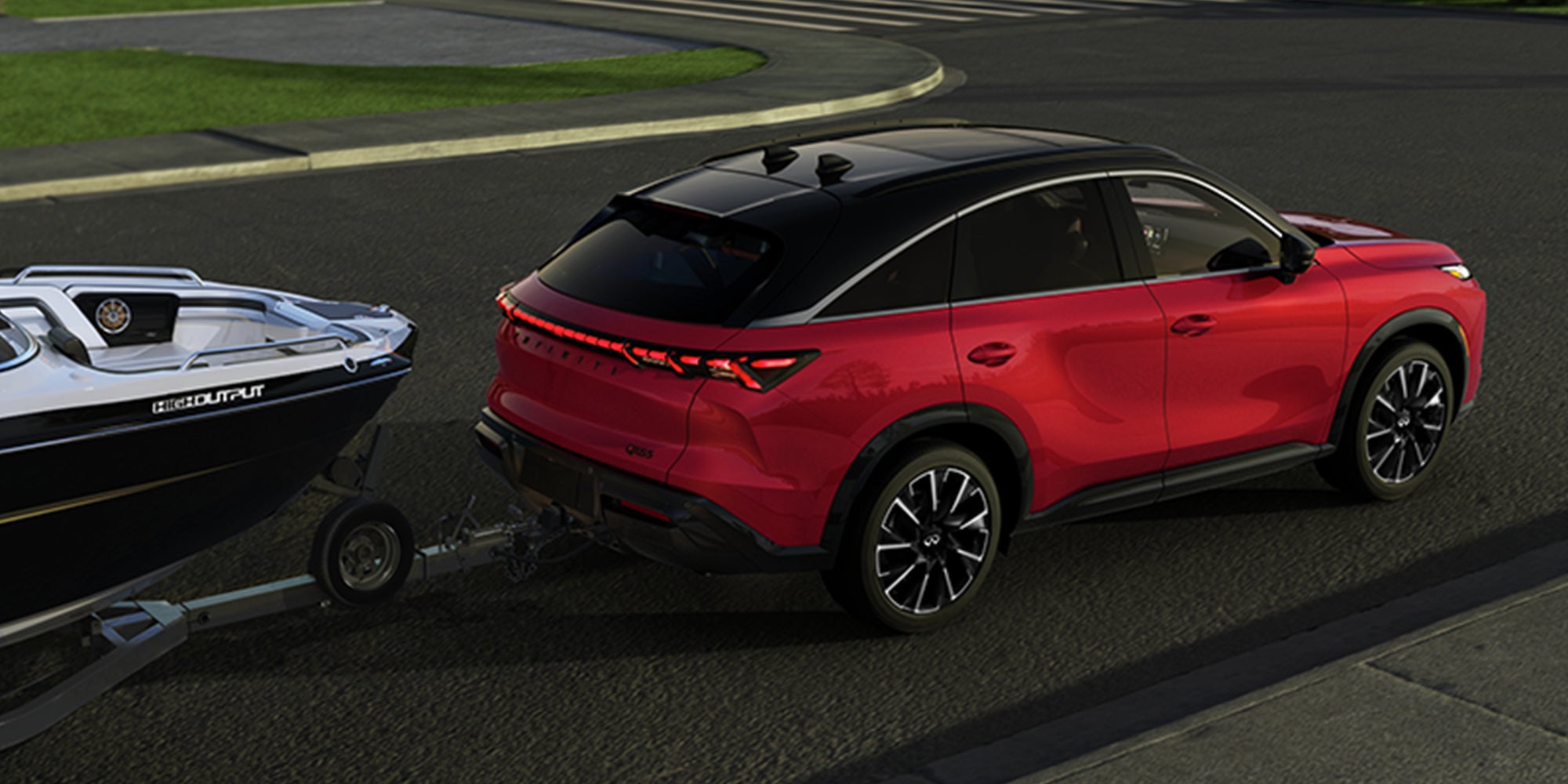 Red INFINITI SUV towing boat trailer