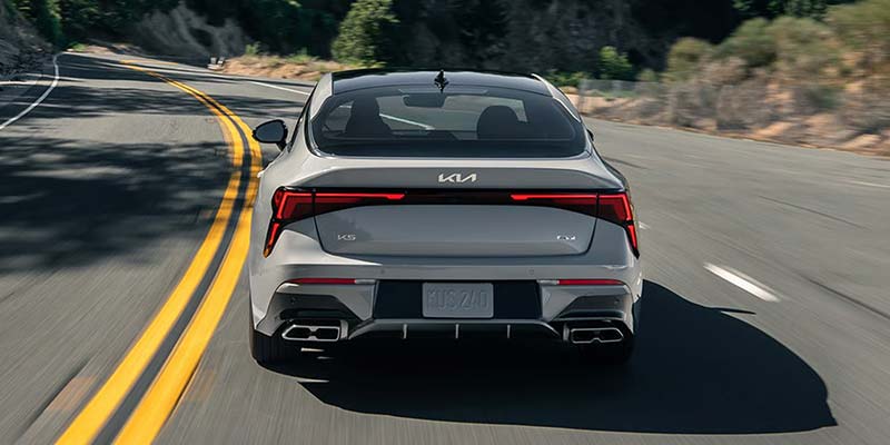 2026 Kia K5 rear view in Batesville AR showing trunk space and sporty design with quad-tip exhaust on GT trim