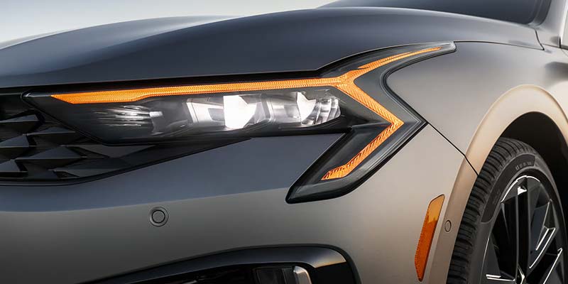 2026 Kia K5 front headlight design in Batesville AR highlighting LED lighting and aggressive styling