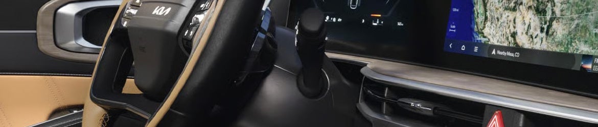 2026 Kia Sorento gear shifter and center console with modern interior controls in Batesville, AR