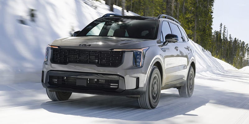 2026 Kia Sorento AWD SUV handling snowy roads with Terrain Mode capability near Batesville, AR